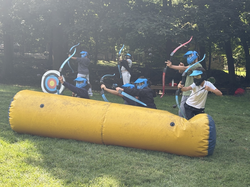 students shooting arrows