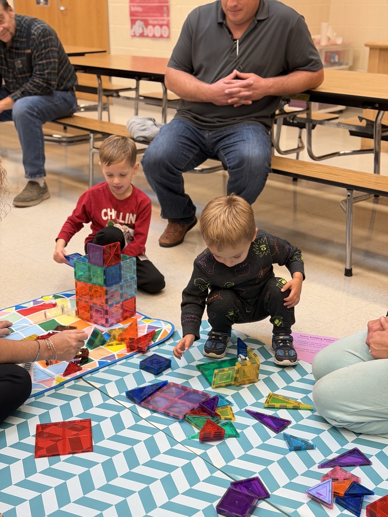 students playing with magnetic building blocks