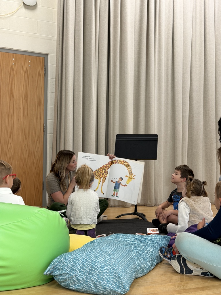 storytime with book that has a giraffe