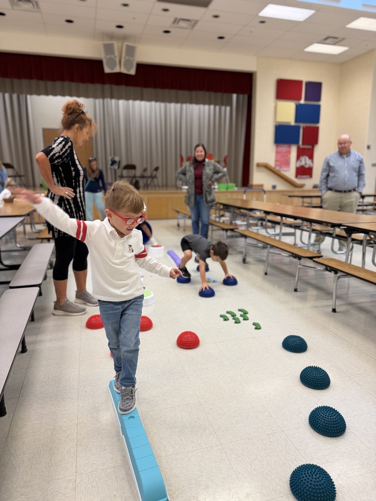 student balancing on balance beem