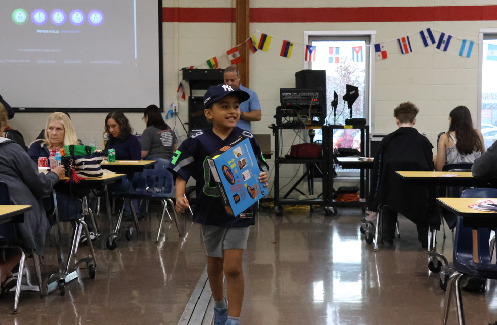 child walking away with a prize