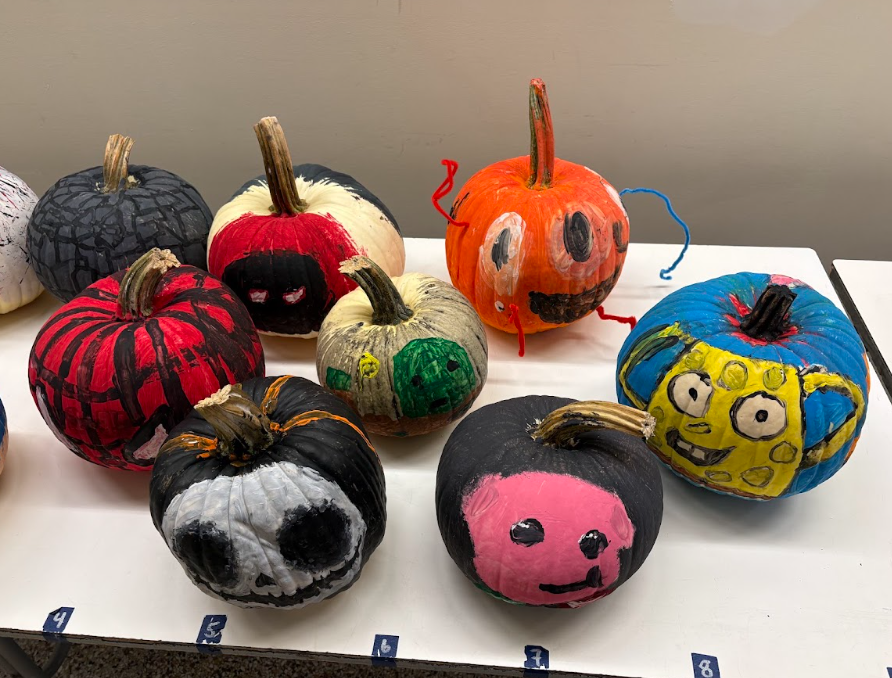 painting pumpkins sitting on table