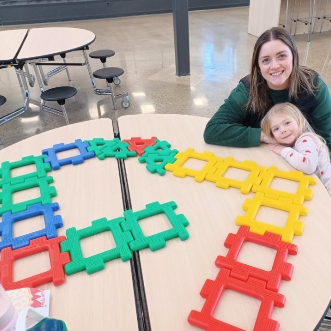 Mom & daughter with building blocks.