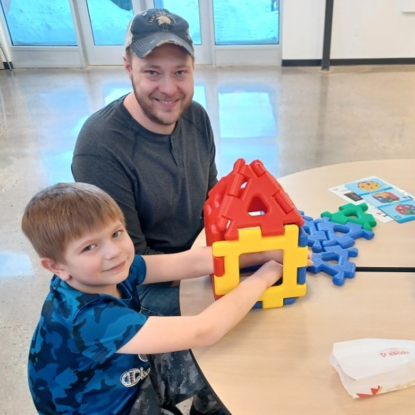 Dad & son with building blocks.