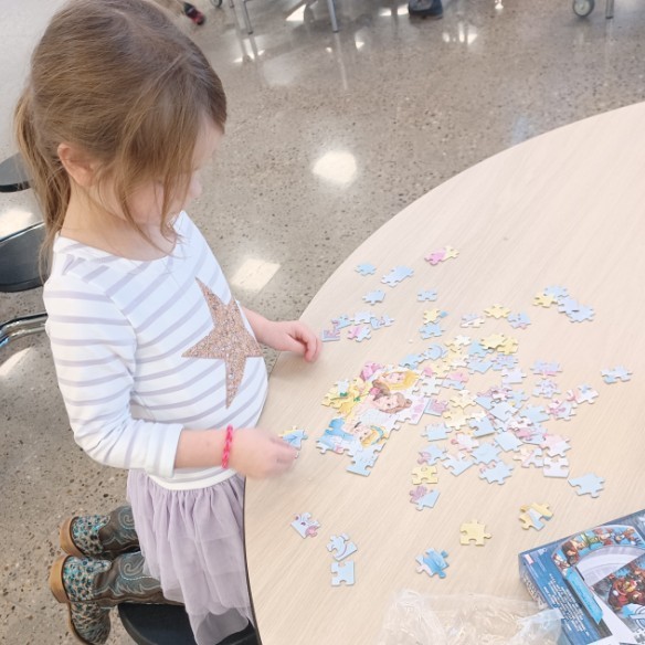 Child doing a puzzle.