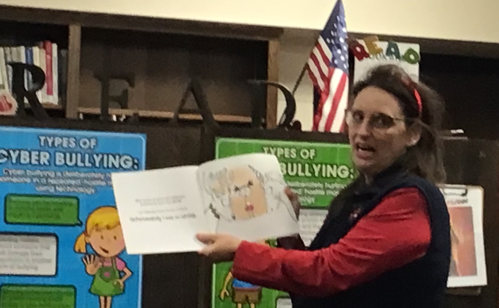 Mrs. Quinn reading a story