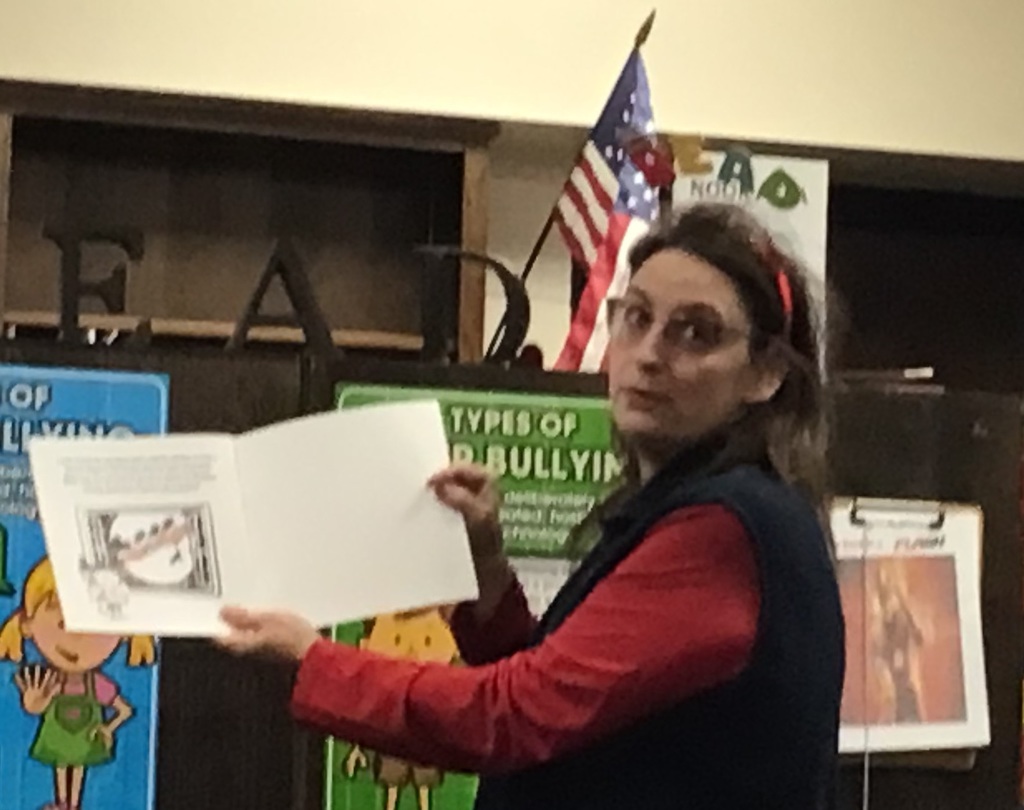 Mrs. Quinn reading a story