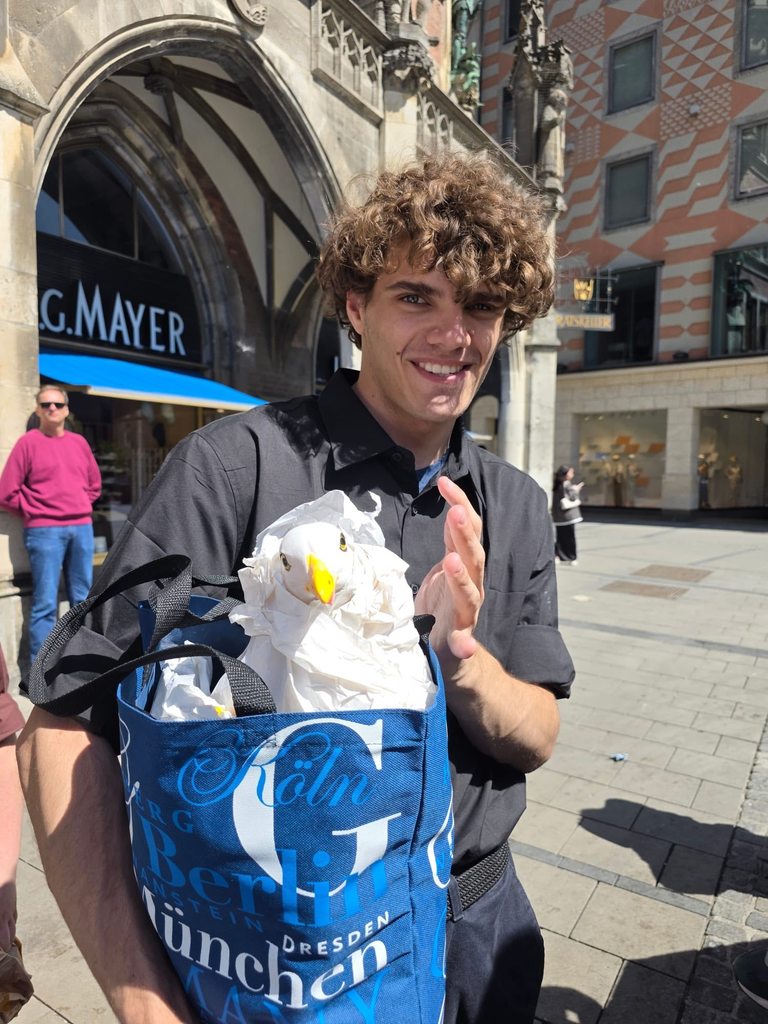 student holding souvenir