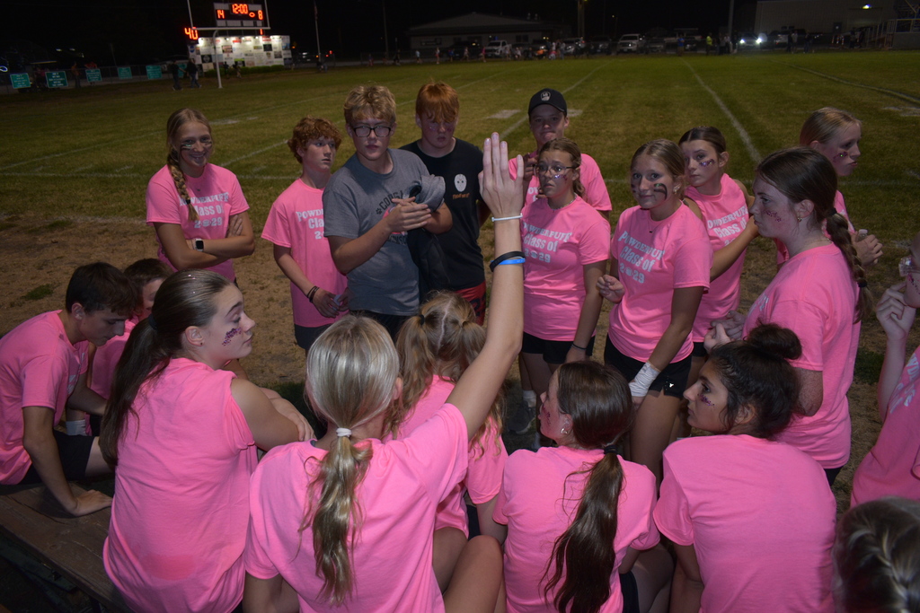 Freshmen getting a pep talk from their coaches