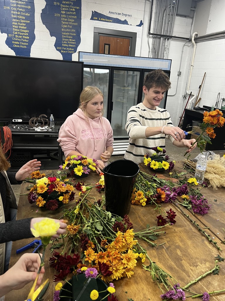 Karoline and Peyton working with flowers