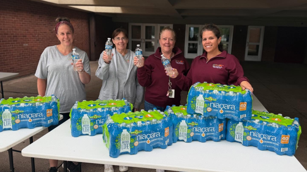 Foodservice workers posing with Niagara water bottles