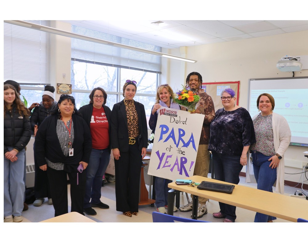 District tleadership congradulating Samuel Dukes on recieving Para of the year Award