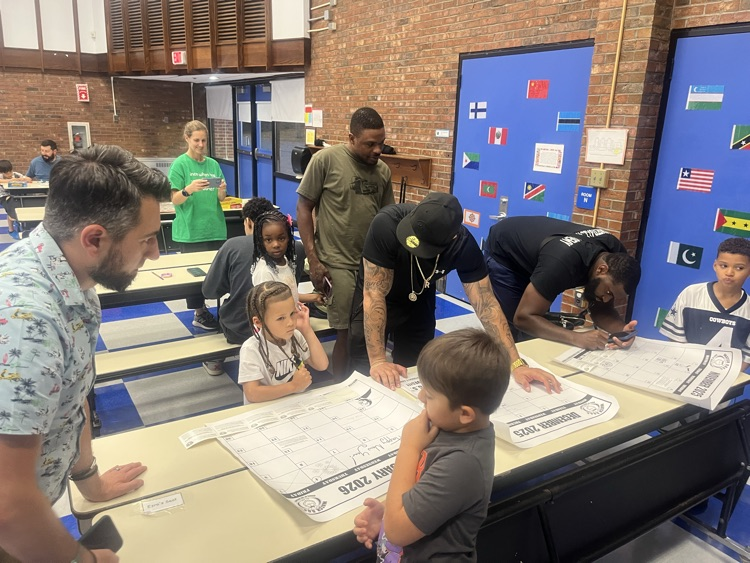 parents signing up at watch dog event in caf
