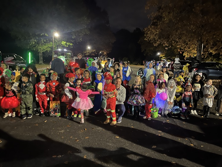 group picture of students at trunk or treat