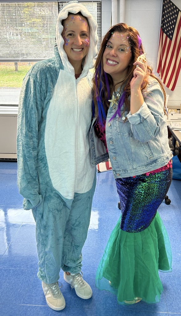 staff dressed as shark and mermaid