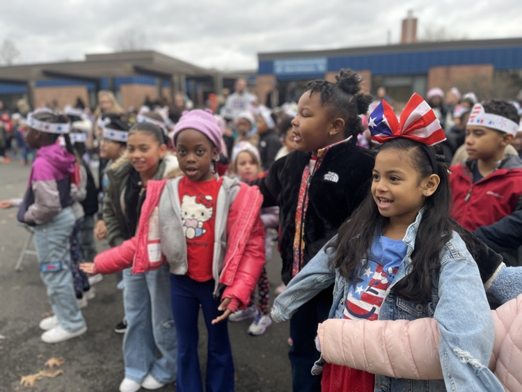 students outside for veteran’s day ceremony