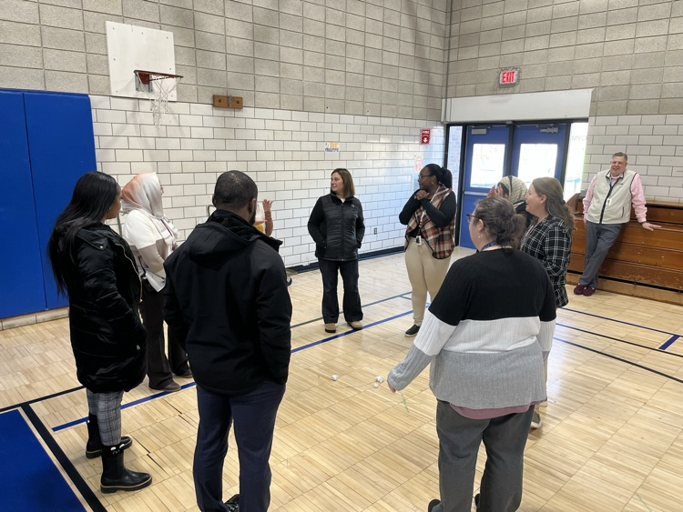 staff having fun with icebreaker at pd in gym at OE