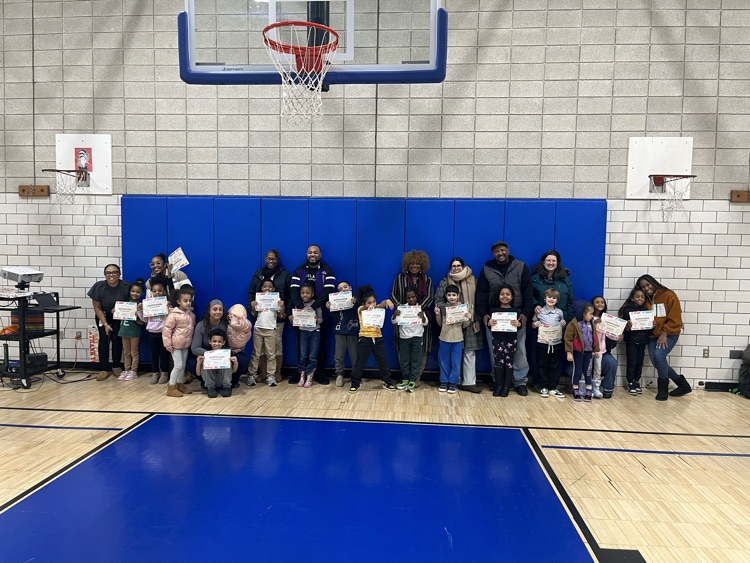 students and their parents in the gym