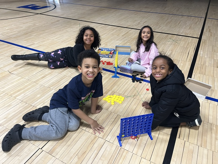 students playing connect 4 in gym