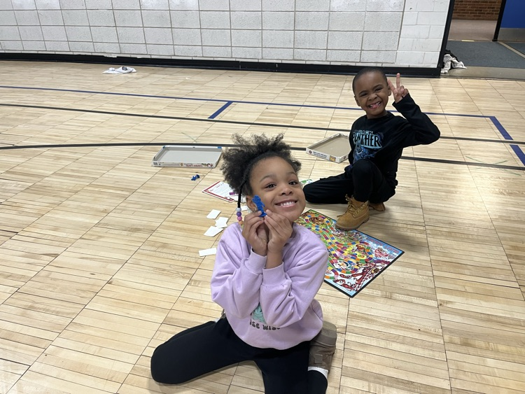 students playing board games in the gym
