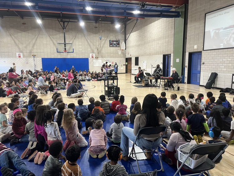 students watching blues and beyond performers in gym