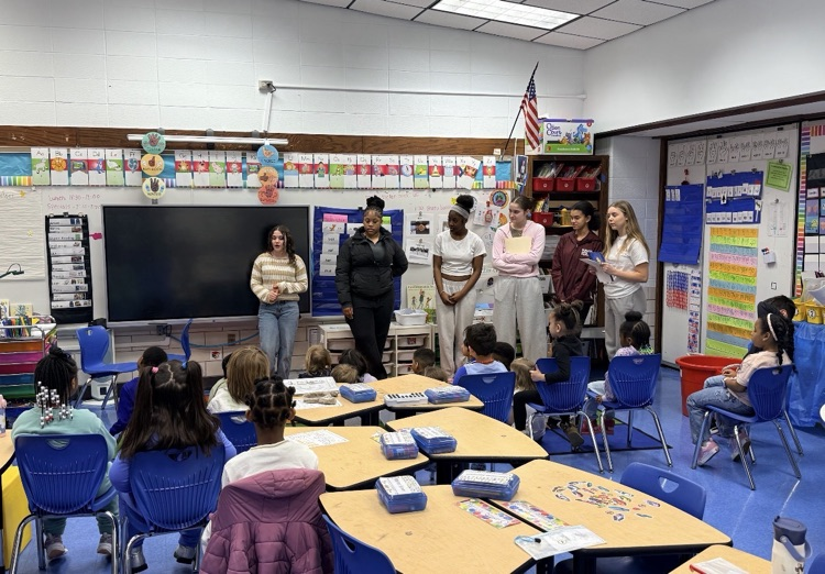 high schoolers presenting in classroom 