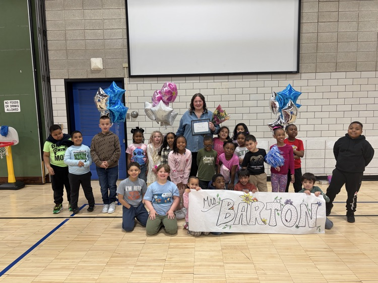 Mrs. Barton and her class in gym