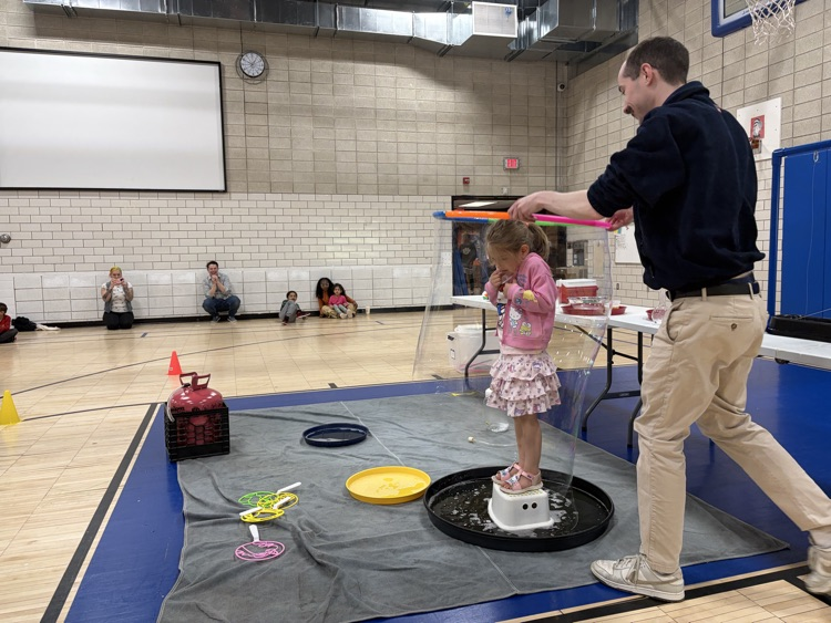 student inside a bubble at science centers assembly in gym