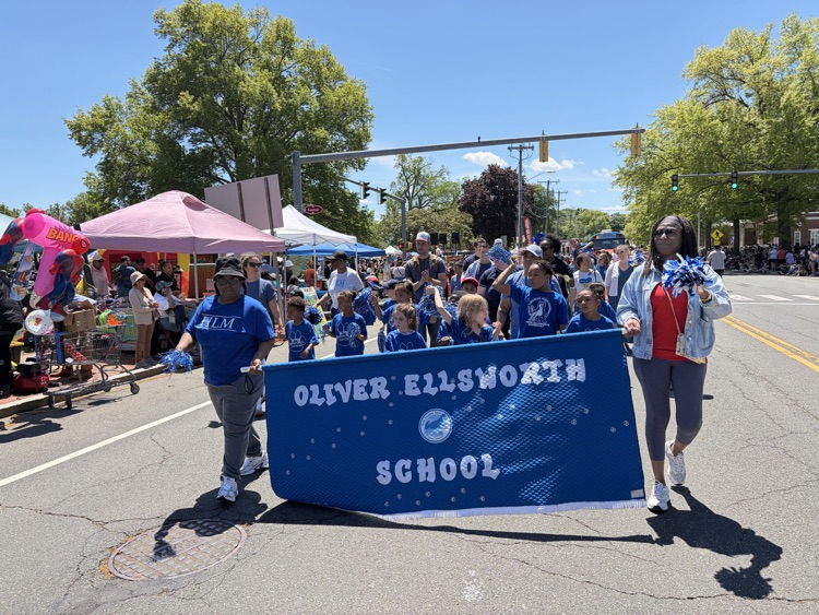OE students and families marching in parade 