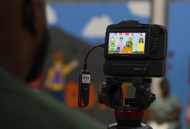 A cameraman from WIN-TV is filming the presentation