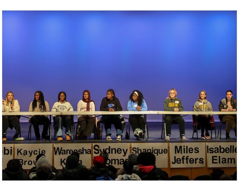 All alums have taken their seats on the stage