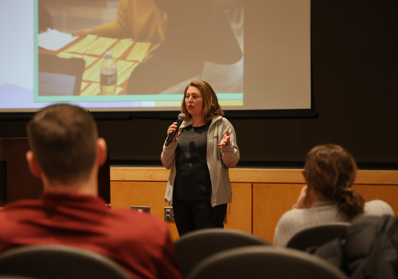 Head English teacher explaining the presenting on the class options available to future students