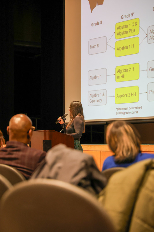 A math teacher explaining math curriculum and classes available to future students