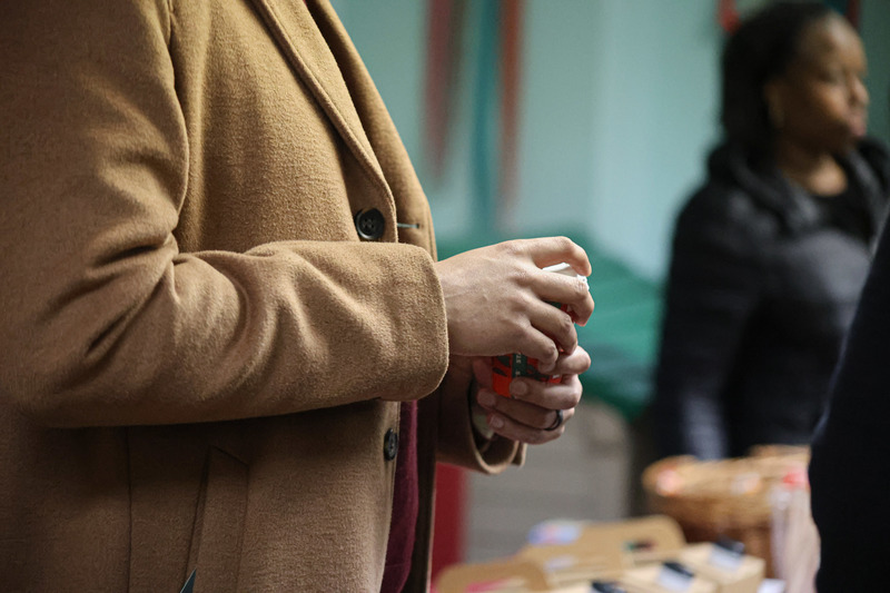 An attendee holding a coffee cup