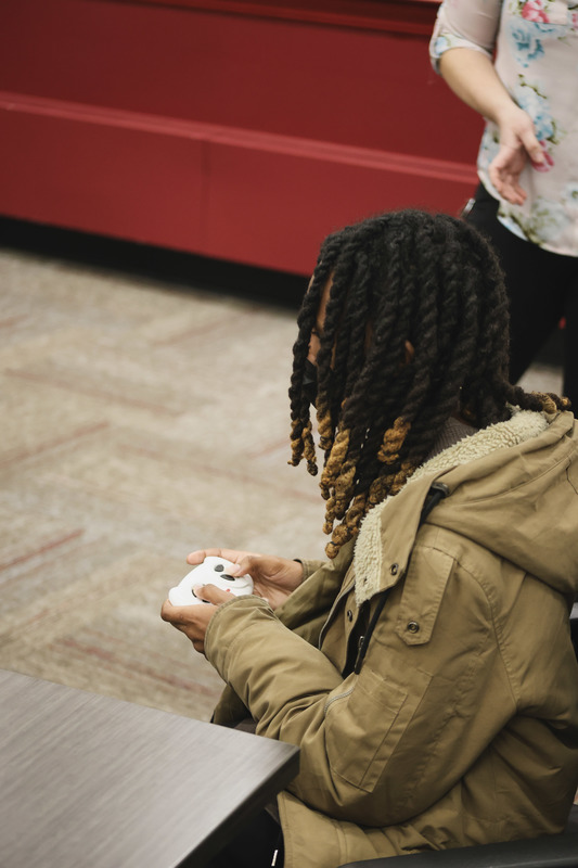 A student is piloting go baby go car