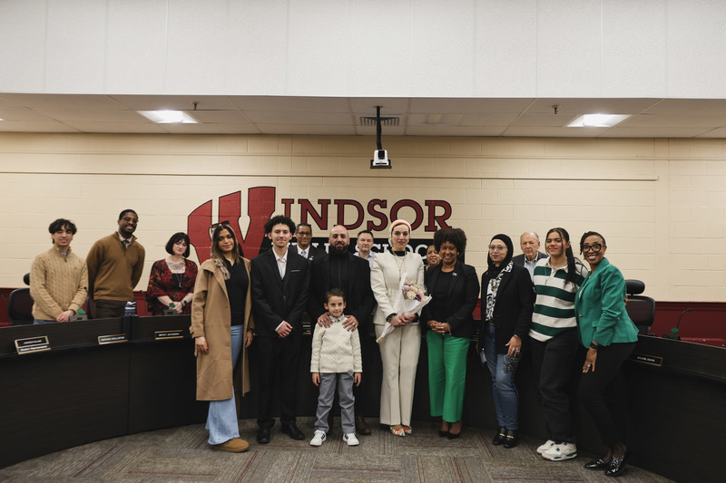 Dr. Hady and her family taking a picure with the board after Dr. Hady gets elected