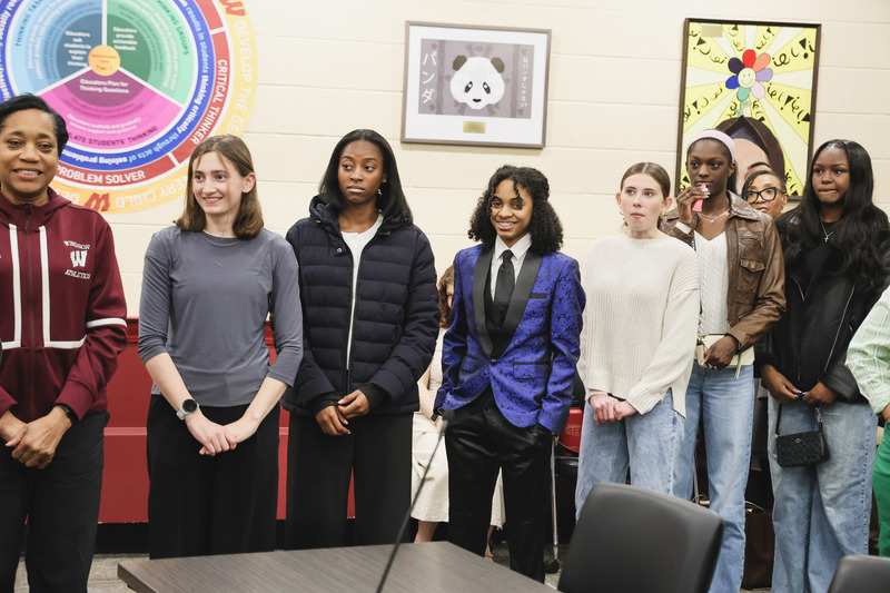 Girl's track team is listening to the speech