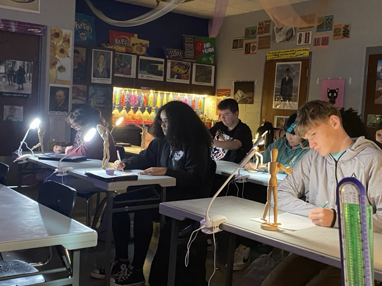 students studying the play of light on a form 