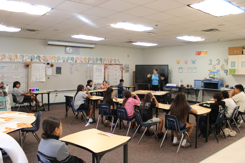 Fourth grade class listening to a presenter