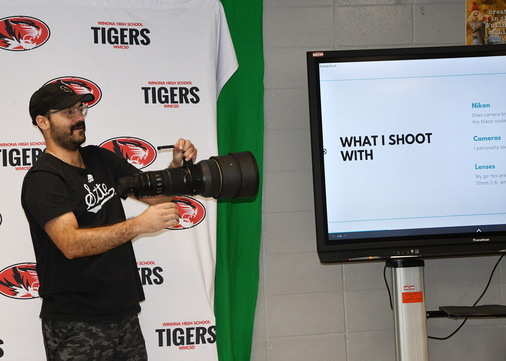 Frayser holds a 400mm lens
