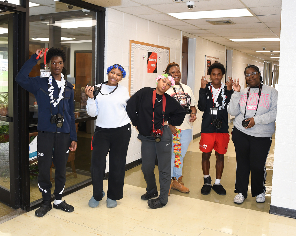 six students holding cameras