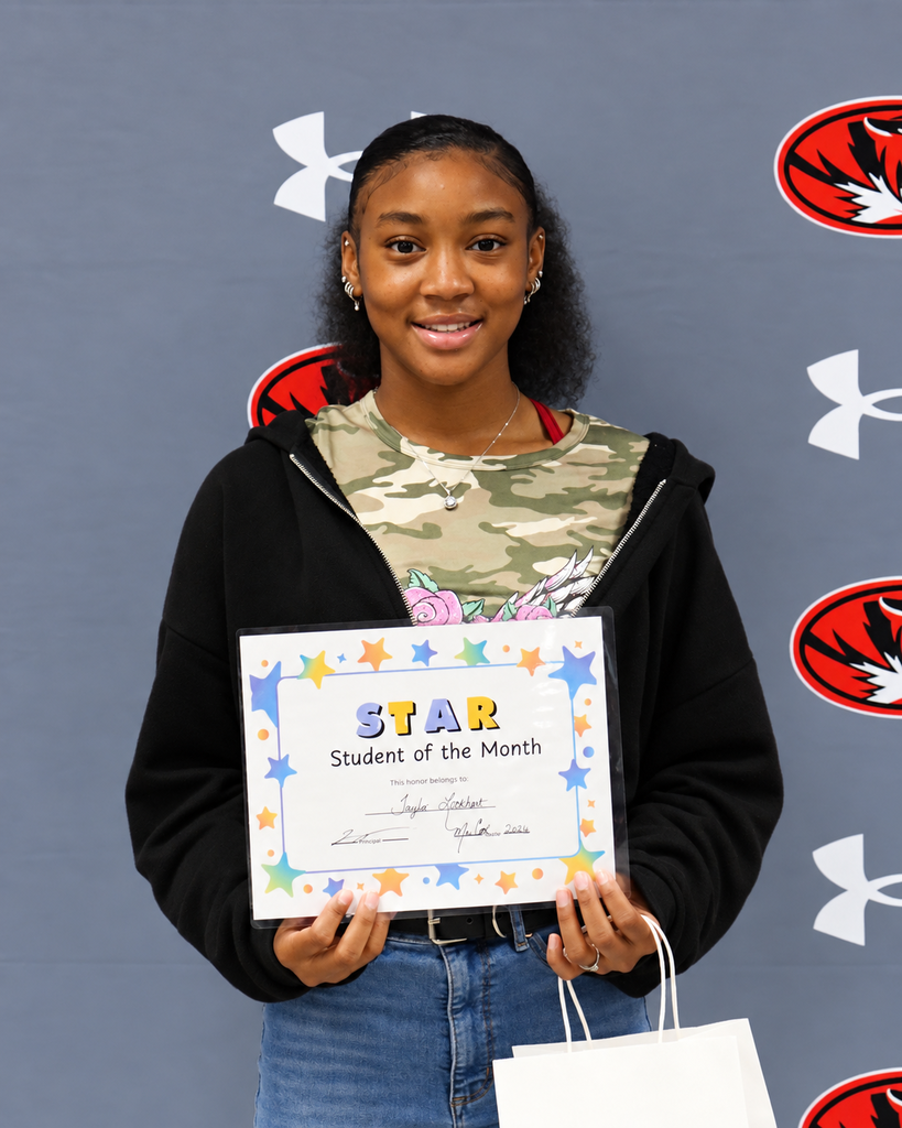 Person holding a certificate that says "STAR Student of the Month" in front of a backdrop with logos.