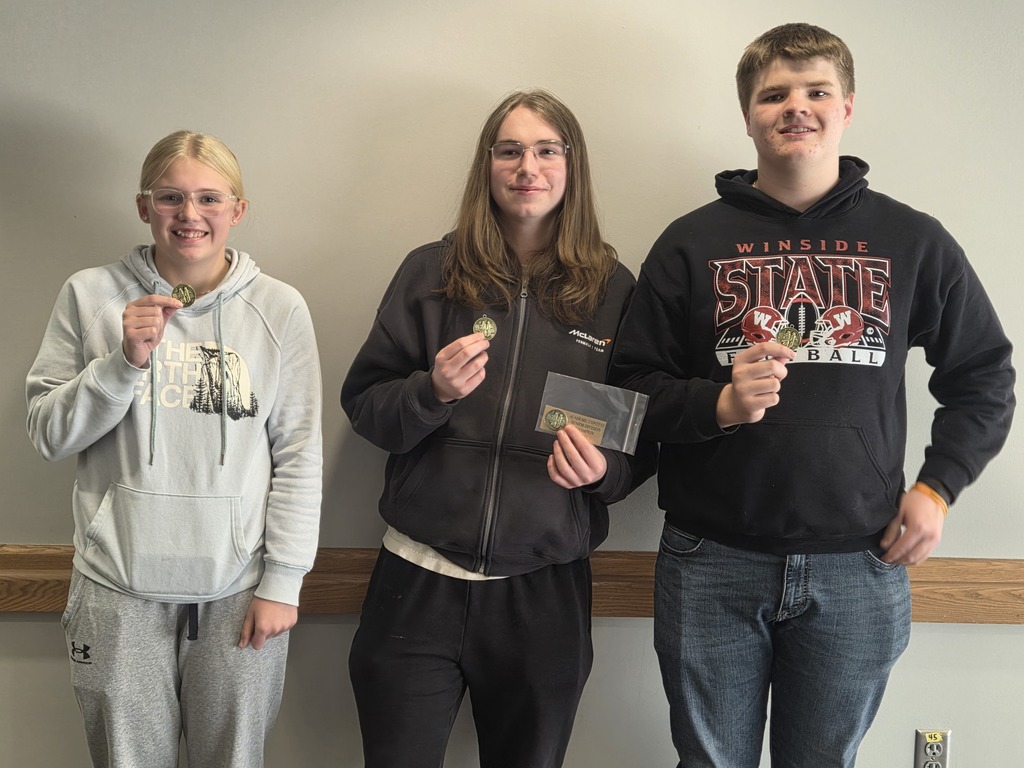 Conference champion quiz bowl students showing their 1st place medals and plaque insert!