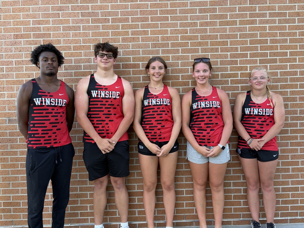 5 students standing in front of a brick wall in Winside Track jerseys