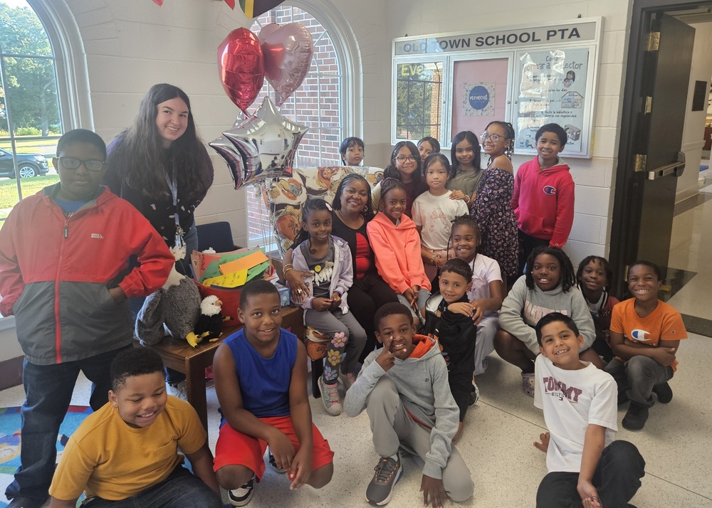 Students taking a picture with Ms. Williams
