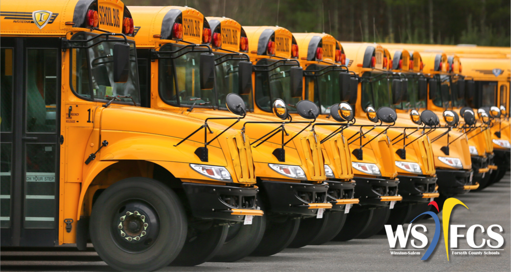 image of a row of busses in parking lot with WS/FCS logo