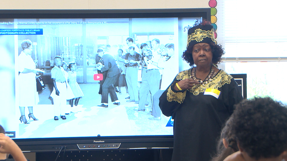 Norma Corley speaking to students at Morgan Elementary