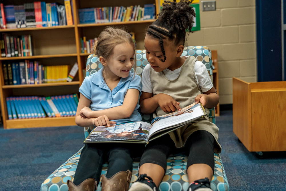 Two students share book