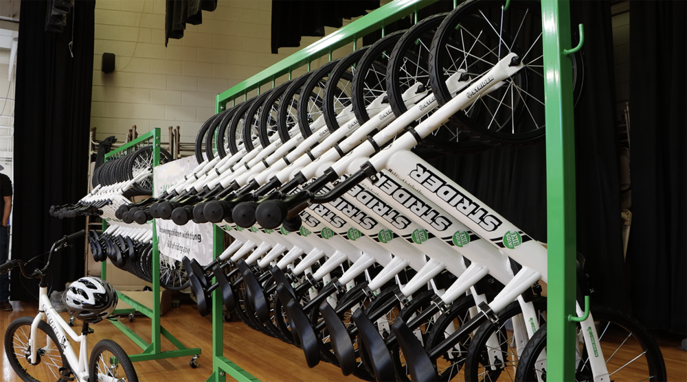 bicycle rack with bicycles hanging on it for students