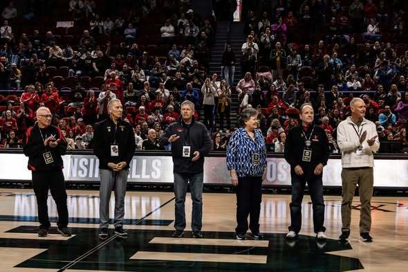 Coach Doucette (third from the left)